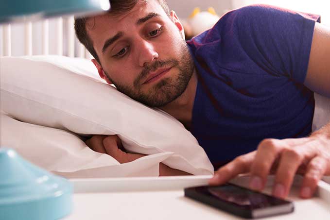 Truck driver laying on bed