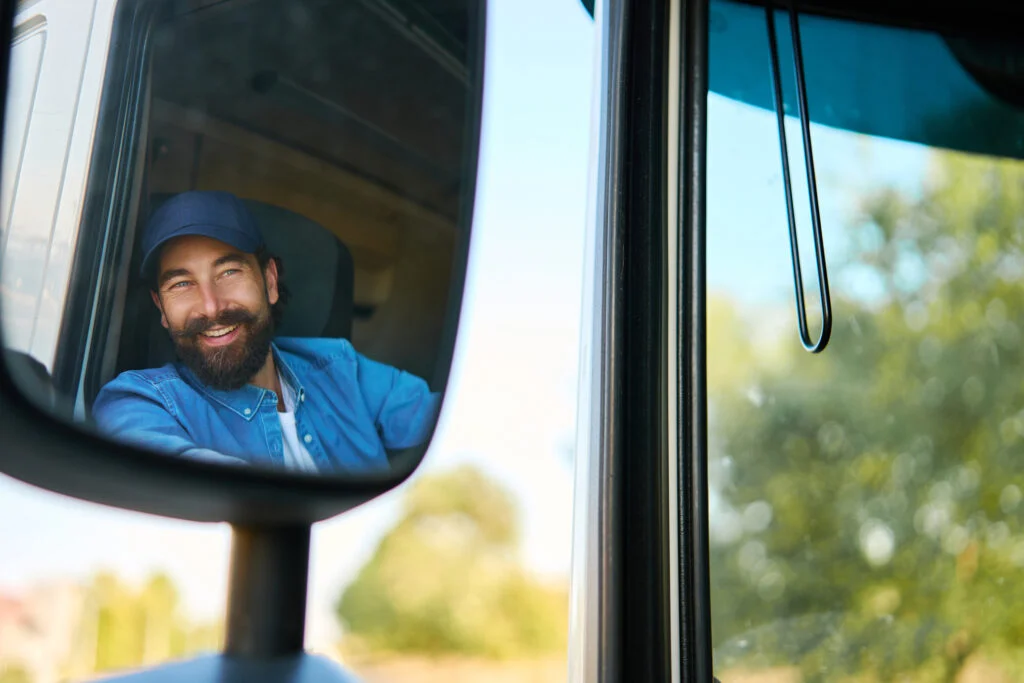 Driver observing backing safety by checking mirror